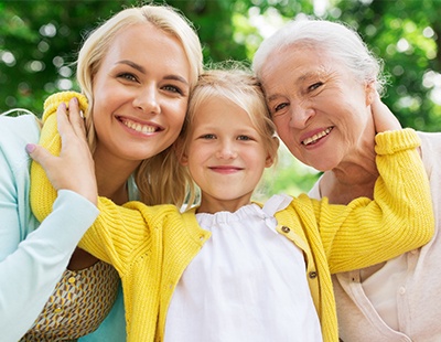 Mother daughter and granddaughter smiling together