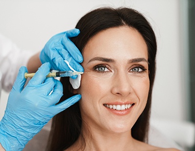 Woman getting a BOTOX® injection