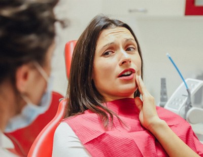 A patient talking to her dentist about a root canal in Aspen Hill