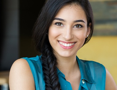 Woman with metal-free dental restoration smiling