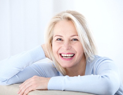 woman grinning from ear to ear 