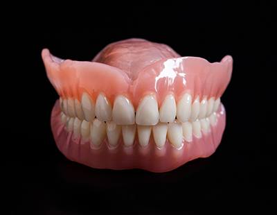 A set of full dentures waiting to be worn by a patient