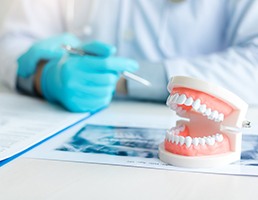 A close-up of dentures on a dentist’s desk