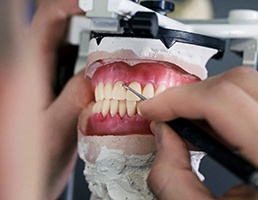a technician in Aspen Hill working on creating dentures
