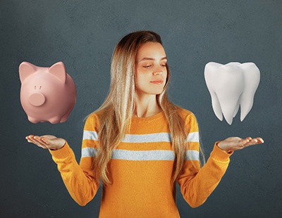 woman deciding between treating a dental emergency and the cost