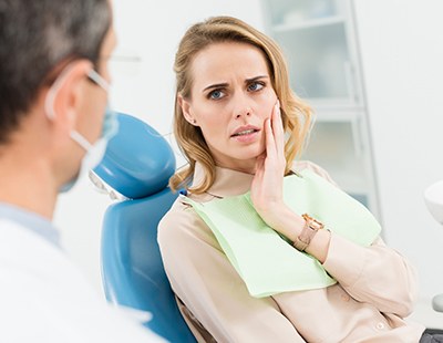 Woman listening to an emergency dentist in Aspen Hill