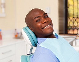 Happy man attending checkup with his dentist in Aspen Hill