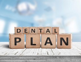 blocks that spell out dental plan in Aspen Hill