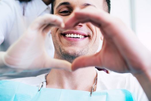 A man getting cosmetic dentistry treatment near Glenmont