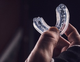 Athlete holding mouthguard in Silver Spring