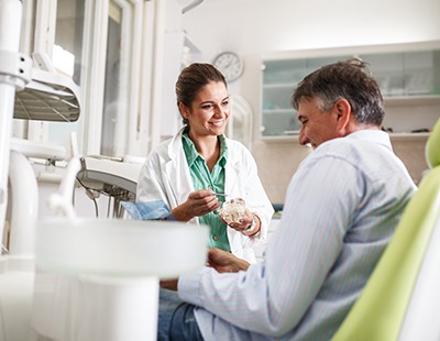 Implant dentist in Aspen Hill speaking with a patient