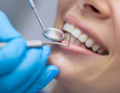 Patient receiving scaling and root planing periodontal therapy