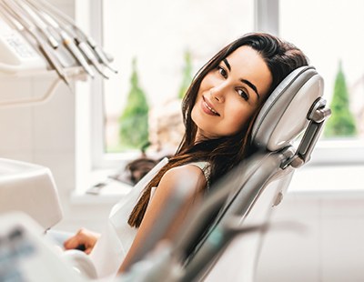 Woman smiling during preventive dentistry checkup