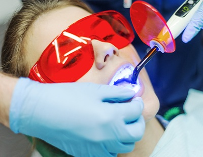 Patient receiving dental sealants