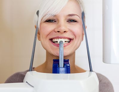 Woman receiving C B CT digital x-ray scans