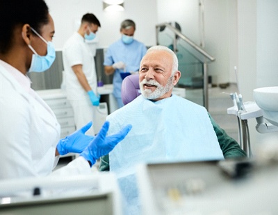 Male patient learning about options for TMJ treatment