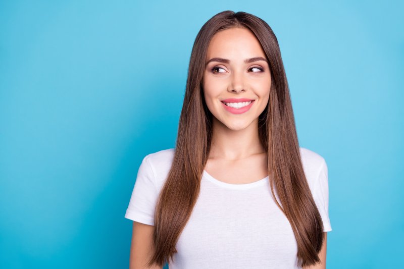 a woman smiling about cosmetic dentistry in Aspen Hill