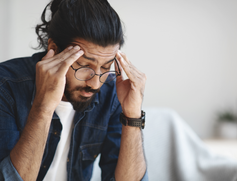 Man holding head in pain